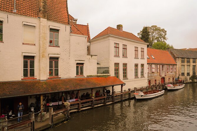 Bruges Guided Day Trip with Canal Cruise Option and Hotel Pickup - Entering Bruges: The Guided Walk Starts Strong