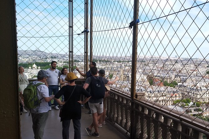 Eiffel Tower Guided Tour by the Stairs up to Second Floor - Stop 2: First level break for panoramic views and quick exploring