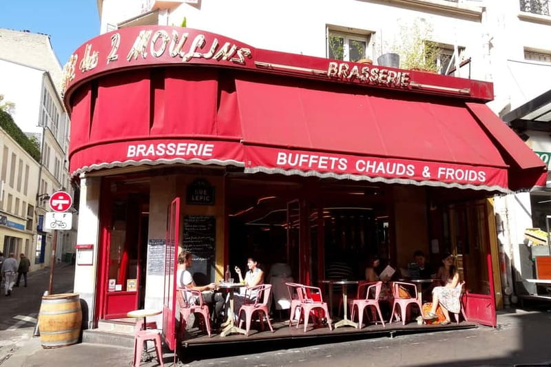 German private Walking Tour through Montmartre & Passages - Starting at Place Blanche and Moulin Rouge: a strong opener