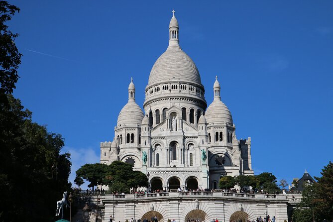 Half-day Walking tour with Fun Guide & Arc du Triomphe Tickets - Quick Central Paris Hits: Hôtel de Ville, Moulin Rouge, Louvre Area