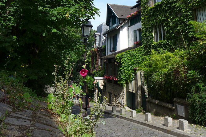 Montmartre Walking Tour, A Journey Through Art and History - Stop 1: Moulin Rouge entrance panels and the story behind the show