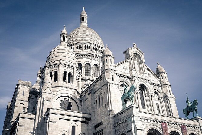 Montmartre Walking Tour Cultural Charm and Tasty Treats - Moulin Rouge and Rue Lepic: cabaret glamour meets café street charm