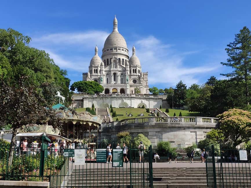 Montmartre Walking Tour with a Local Guide - Wall of Love and Moulin de la Galette: where icons sit in real streets
