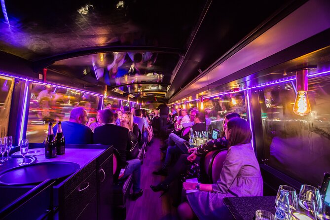 Paris 5-Course Dinner Bus Toque with Champagne from Opéra - Louvre Pyramid and Notre-Dame: big icons, framed for night viewing