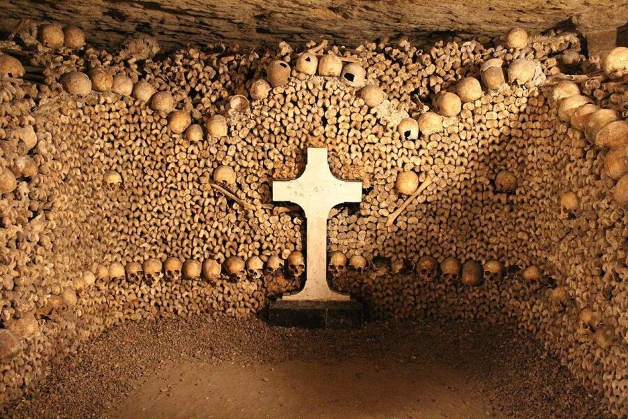 Paris: Catacombs Entry & Seine River Cruise with Audio Guide - Going underground: stairs, cold tunnels, and what to expect