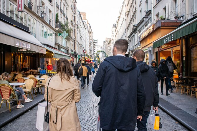 Paris Christmas Food Tour with a Local Guide, and Seasonal Treats - Place Saint-André des Arts: a seated café where the winter menu lands
