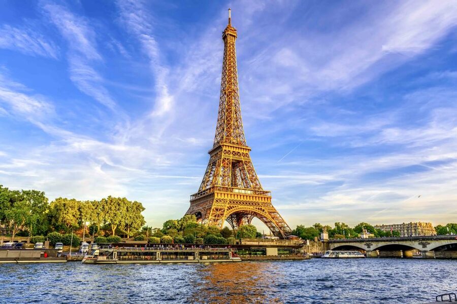 The Eiffel Tower above the Seine at golden hour
