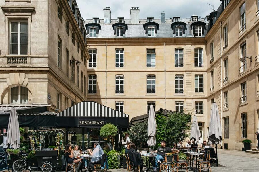 Paris: Emily TV Show Locations Guided Walking Tour - Colonnes de Buren: modern art that makes you look at the sidewalk differently