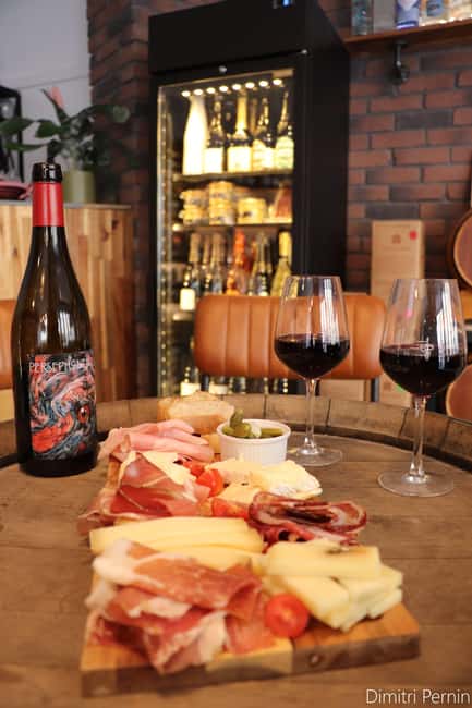 Paris: French wine tasting with cheeses and charcuterie - La Cave du Canal: a wine cellar stop near Gare du Nord/Est