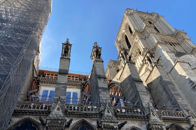 Paris Île de la Cité and Notre-Dame Walking Tour With Crypt - Clock Towers and Royal Justice Beyond the Cathedral Gates
