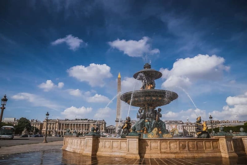 Paris: Louvre Museum Entry Ticket and Garden Walking Tour - Louvre Pyramid stop: photos first, then the big-picture framing