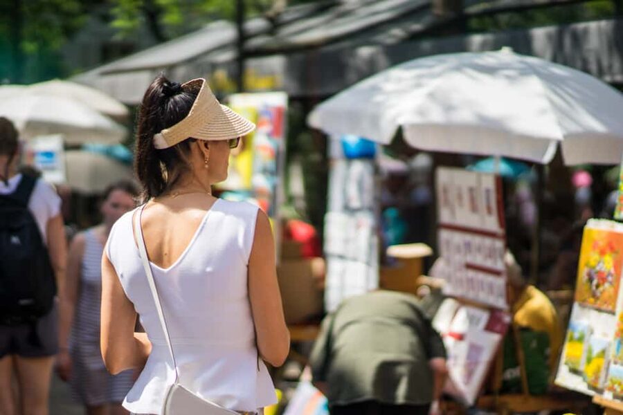 Paris: Montmartre Group Tour in German - Moulin de la Galette and the hill’s classic look