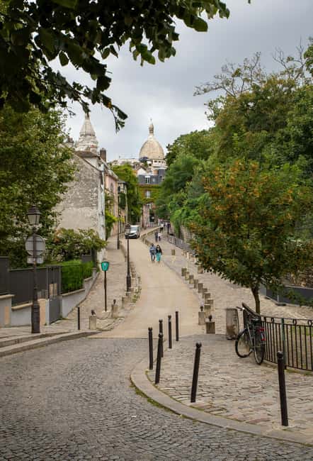 Paris: Montmartre hidden gems walking Tour with Local Guide - Moulin de la Galette and the 1920s mood shift on foot