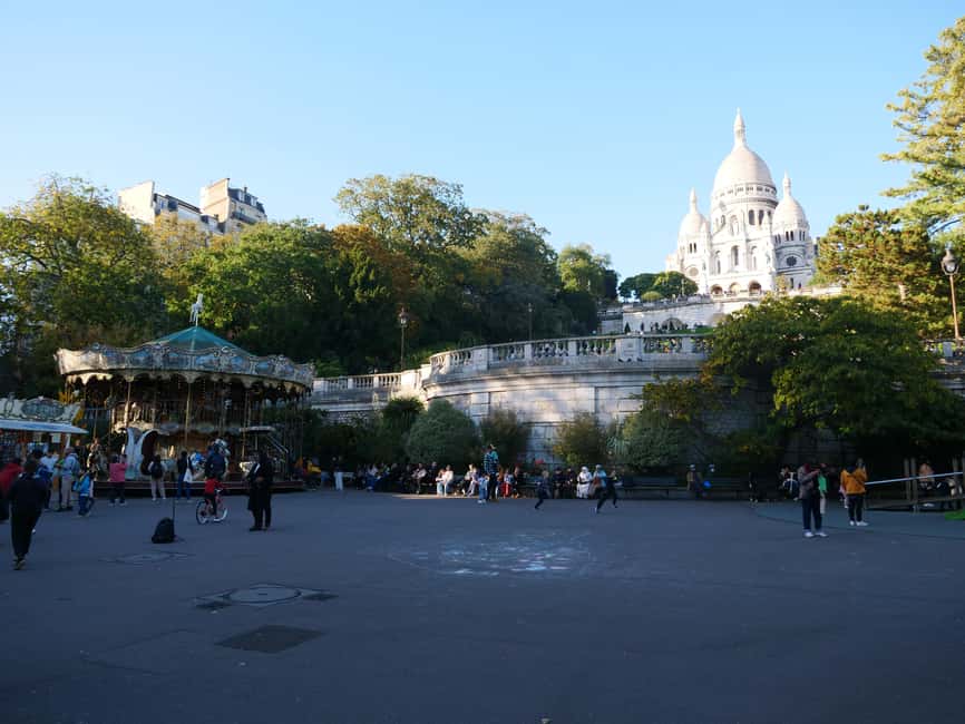 Paris: Montmartre Must-See Walking Tour with a Local Guide - Carrousel de Saint-Pierre and Square Louise Michel: setting the tone for the climb
