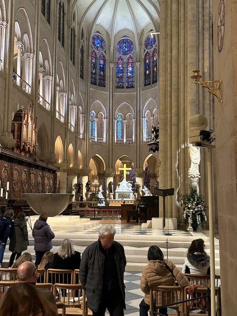 Paris: Notre Dame Cathedral Guided Tour of the Neighborhood - Price and value: $22 is mostly paying for interpretation