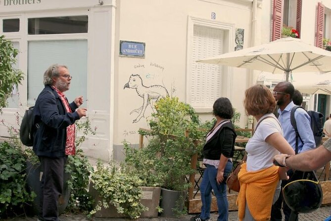 Paris: Street Art Tour with a Street Artist Guide - Montmartre: cobbled lanes, art addresses, and modern wall signatures