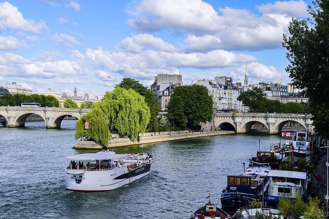 Seine River Guided Cruise by Vedettes de Paris - City government, royal prison stories, and Louvre scale