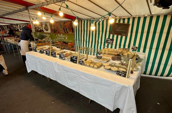 Sunday morning Eiffel Tower Food Market Tour -Max 8 people - Marche Grenelle open-air market: charcuterie, cheese, macarons, and honey lollipops