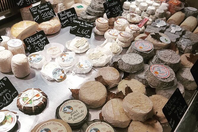 The Paris of the Parisians - Marché Couvert des Enfants Rouges: brie, baguettes, and locals testing daily