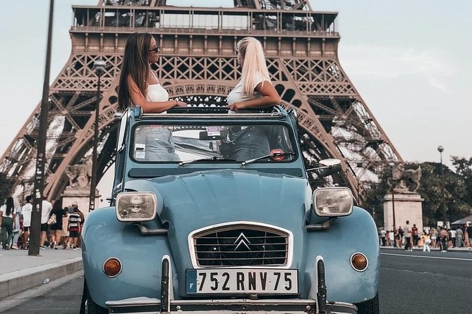 Vintage 2CV Adventure: 1 Hour 30 min Paris Secrets Tour - Place des Vosges from the 2CV: symmetry, arcades, and a calmer pace